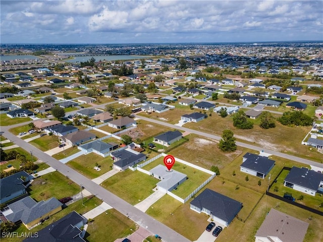 aerial view featuring a water view and a residential view