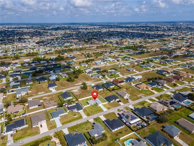 birds eye view of property with a residential view