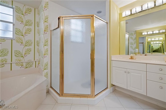 bathroom with vanity, tile patterned floors, a bath, and a stall shower