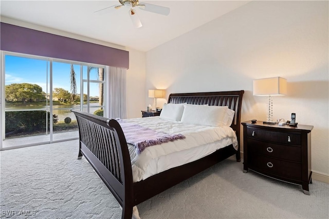 bedroom featuring light carpet, ceiling fan, and access to outside