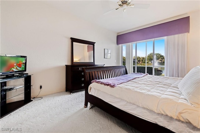 carpeted bedroom featuring ceiling fan and baseboards