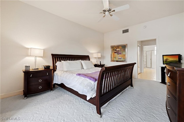 bedroom featuring visible vents, light carpet, baseboards, and a ceiling fan