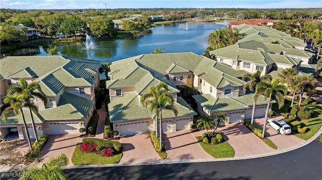 aerial view with a residential view and a water view