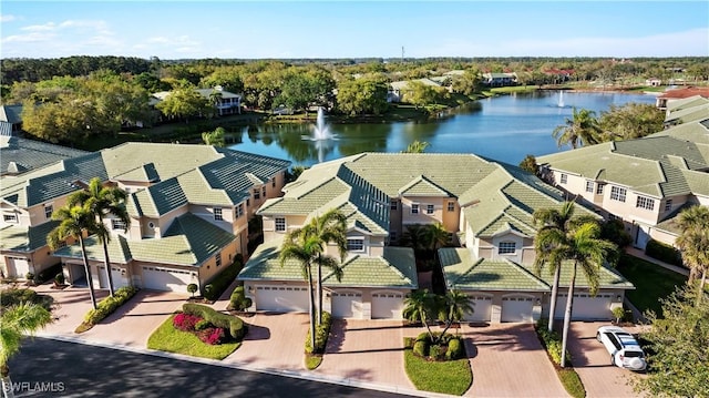 bird's eye view with a residential view and a water view