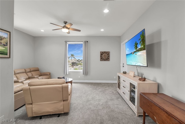 living area with light carpet, baseboards, a ceiling fan, and recessed lighting