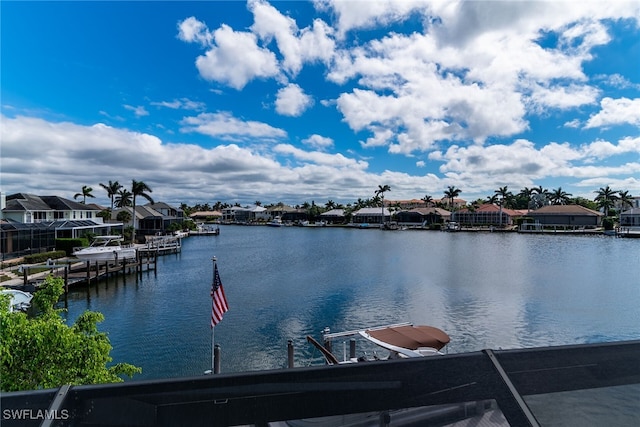 view of water feature with a boat dock and a residential view