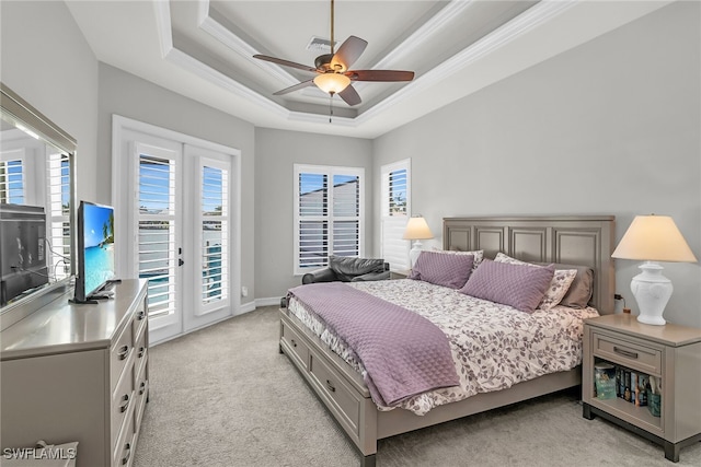 bedroom featuring crown molding, a raised ceiling, light colored carpet, visible vents, and access to outside