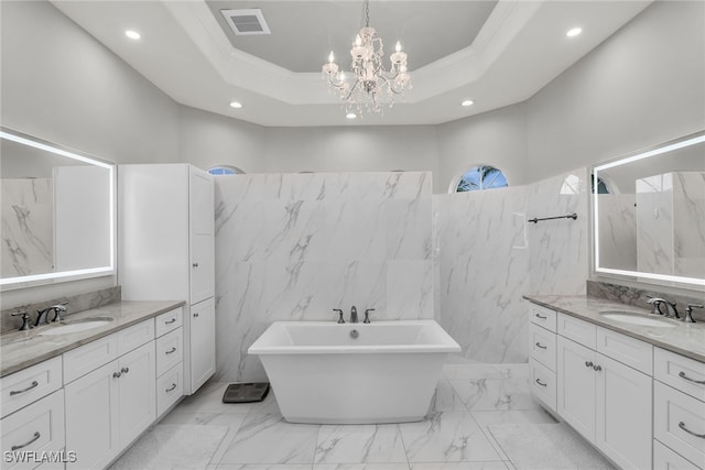 bathroom with two vanities, a sink, and visible vents