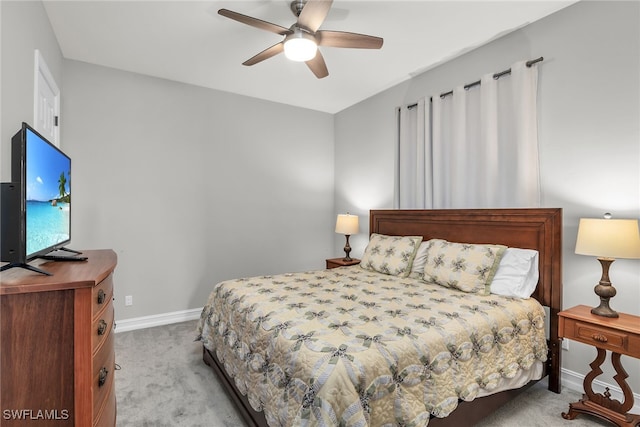 bedroom with carpet, baseboards, and a ceiling fan