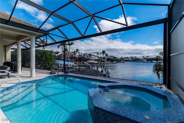 view of swimming pool with a patio, a pool with connected hot tub, a water view, and glass enclosure