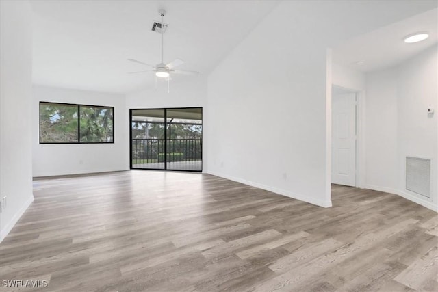 empty room with ceiling fan, light wood-style flooring, visible vents, and baseboards