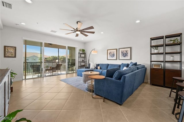 living room with light tile patterned floors, recessed lighting, visible vents, and a ceiling fan