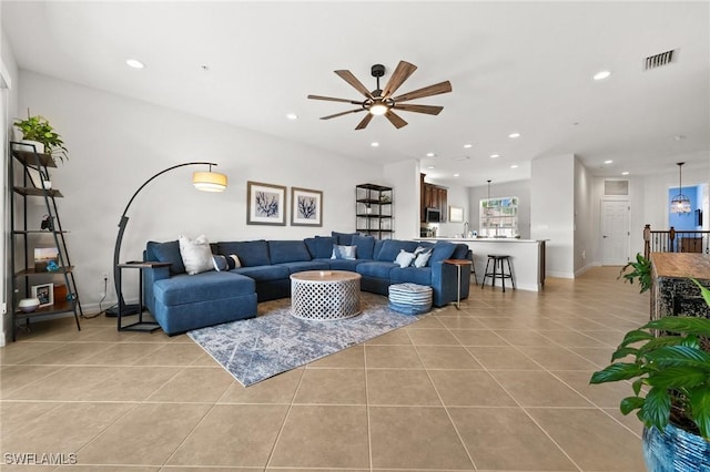 living area featuring a ceiling fan, light tile patterned flooring, visible vents, and recessed lighting