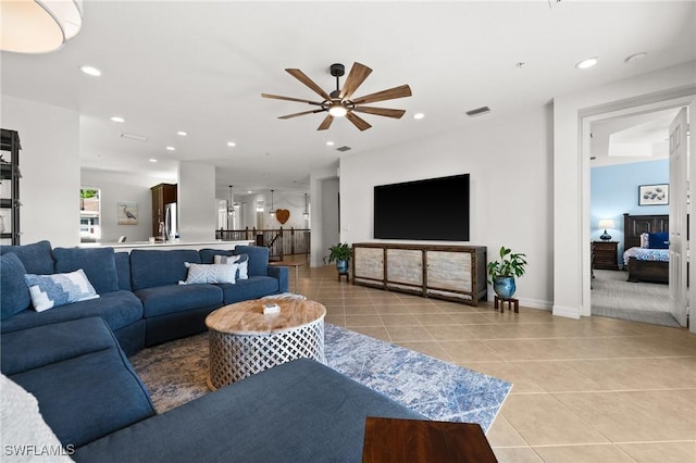 living area with a ceiling fan, light tile patterned flooring, visible vents, and recessed lighting