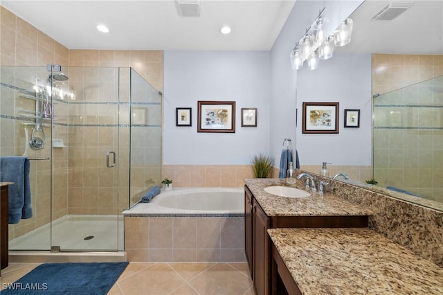 full bath with a garden tub, vanity, visible vents, a shower stall, and tile patterned floors