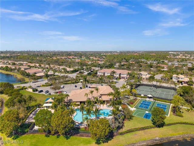 drone / aerial view with a water view and a residential view