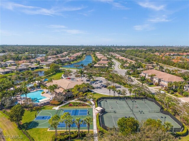 drone / aerial view featuring a water view and a residential view