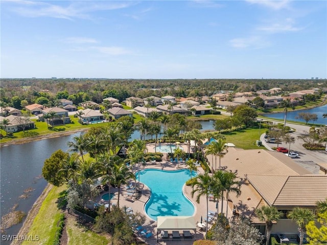 birds eye view of property with a residential view and a water view