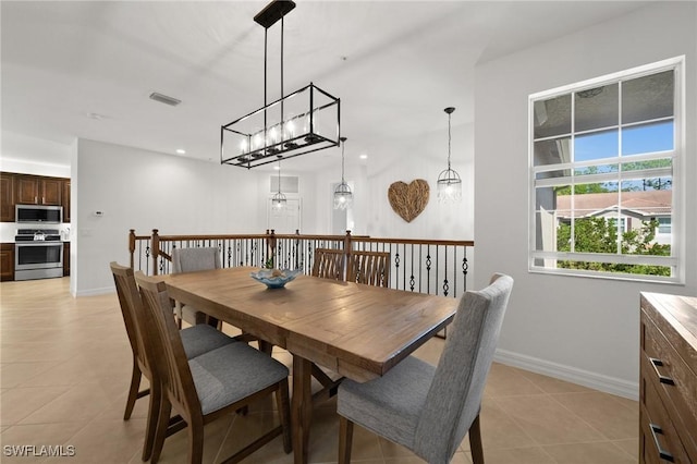 dining room featuring visible vents, baseboards, and light tile patterned floors