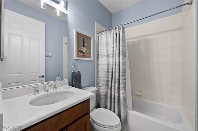 full bathroom featuring shower / bath combo, vanity, and toilet