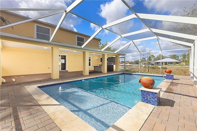 pool with a lanai and a patio