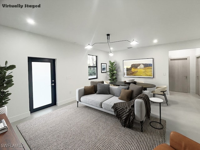 living room with baseboards and recessed lighting