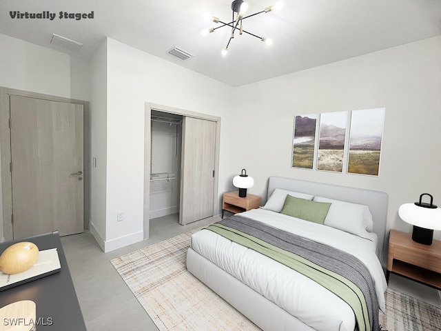 bedroom featuring a closet, visible vents, finished concrete floors, a chandelier, and baseboards