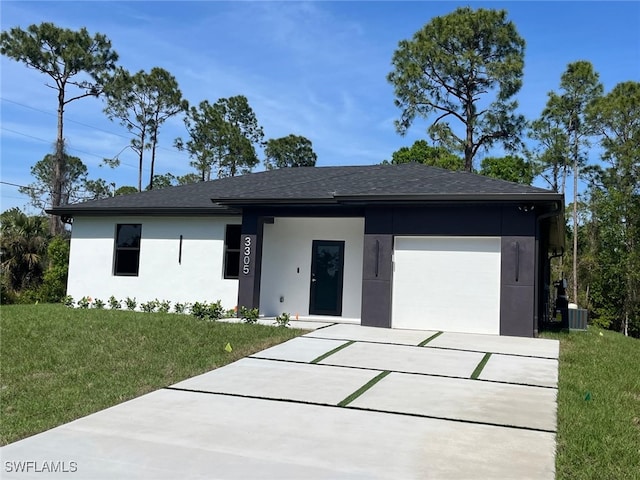 view of front of property featuring a garage, driveway, roof with shingles, a front yard, and stucco siding