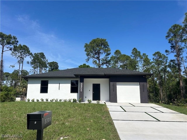 view of front facade featuring a garage, concrete driveway, a front lawn, and stucco siding