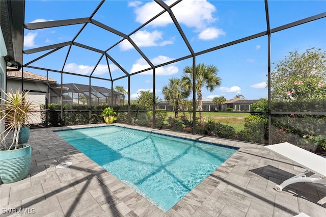 pool with a patio area and a lanai