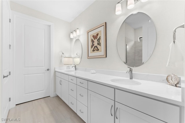 bathroom featuring double vanity and a sink