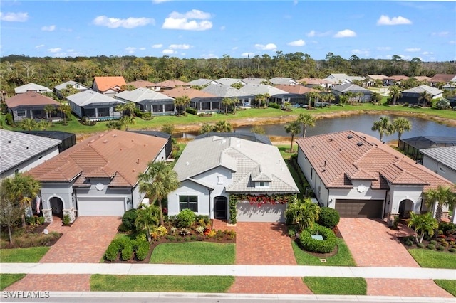 bird's eye view with a residential view and a water view