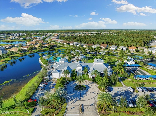 bird's eye view featuring a water view and a residential view