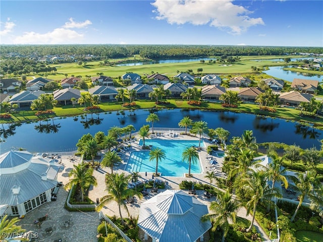 birds eye view of property with a water view and a residential view