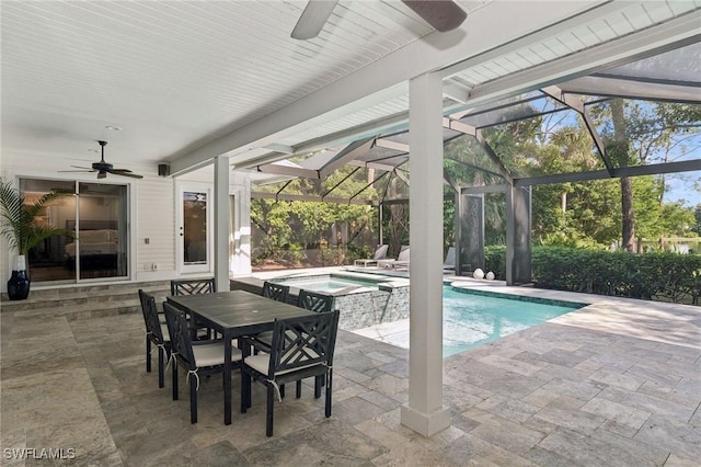 view of pool with a lanai, a patio area, ceiling fan, and a pool with connected hot tub