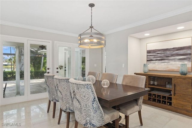 dining room featuring crown molding and recessed lighting