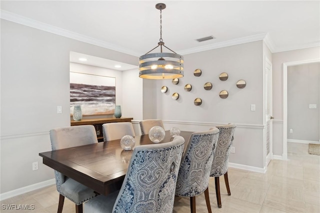 dining room featuring visible vents, crown molding, a notable chandelier, and baseboards