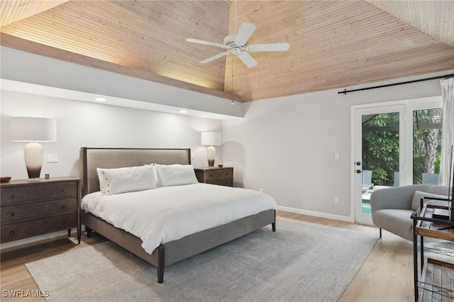 bedroom featuring baseboards, wood ceiling, access to exterior, light wood-style floors, and high vaulted ceiling