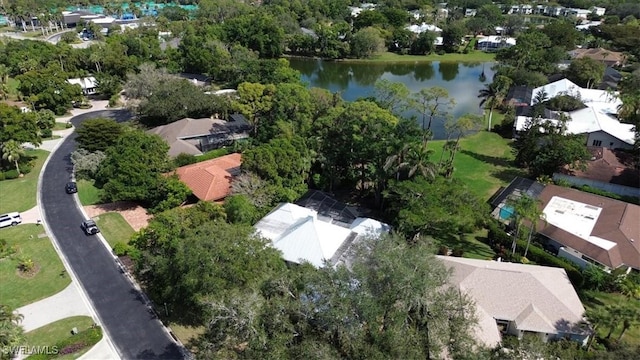 birds eye view of property with a water view and a residential view