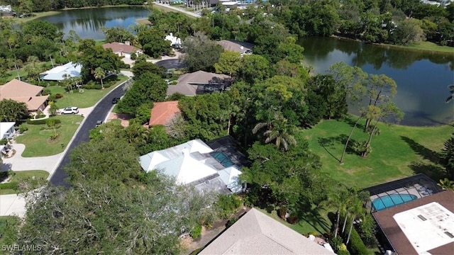 drone / aerial view with a residential view and a water view