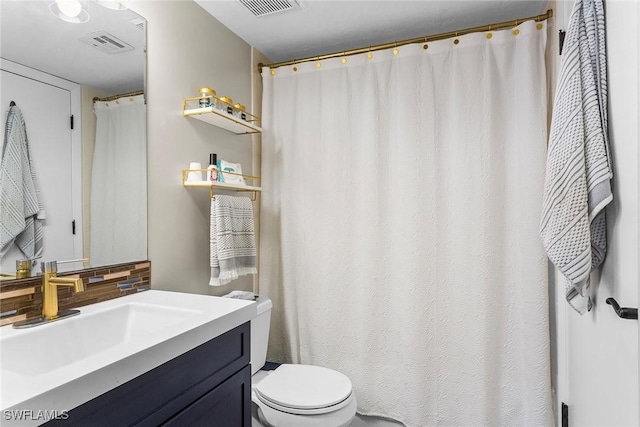 full bath with toilet, backsplash, vanity, and visible vents