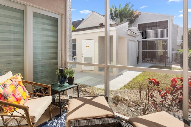 balcony with a sunroom and a patio