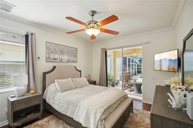 bedroom with access to outside, multiple windows, visible vents, and crown molding