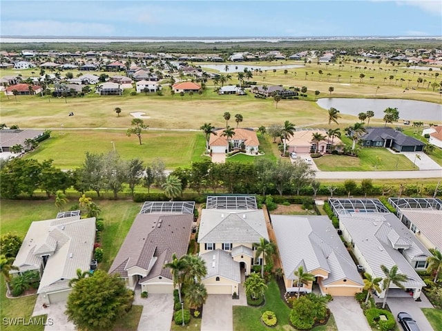 birds eye view of property with a residential view, a water view, and golf course view