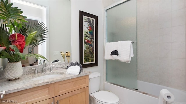 8342 Provencia Ct, Fort Myers, FL 33912 - full bath with vanity, toilet, and shower / bath combination with glass door