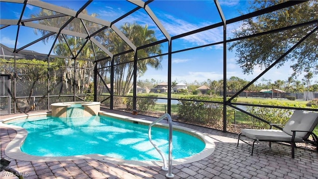 view of pool featuring a lanai, a patio area, and a pool with connected hot tub