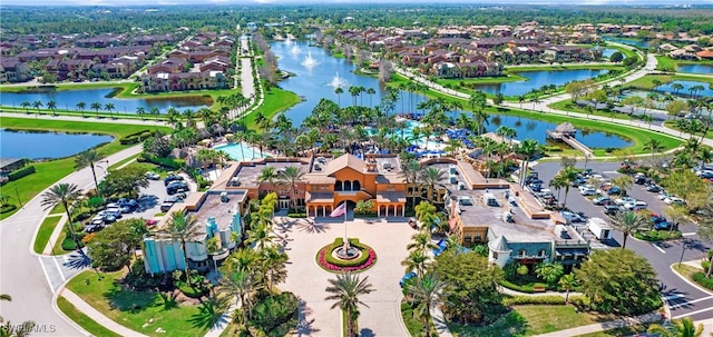 drone / aerial view with a water view and a residential view