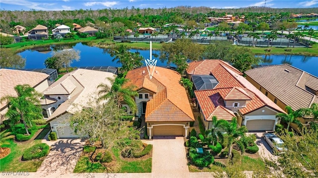 birds eye view of property with a water view and a residential view