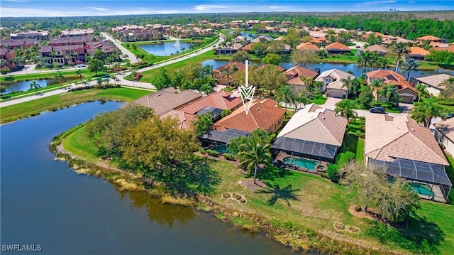 aerial view with a water view and a residential view