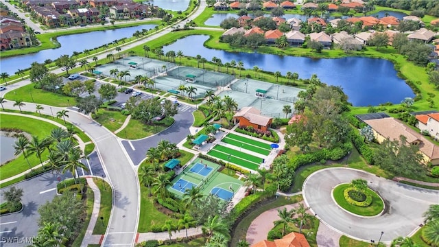 birds eye view of property featuring a residential view and a water view